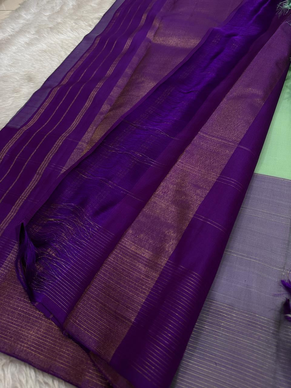 Ashva ✨ – Violet & Mint Pure Silk Kanchipuram Saree
Gold Zari Horse & Rooster Motifs in Kattam Checks
Linear Zari Border with Grand Violet Striped Pallu
Mint Green Blouse with Zari Border Included
Silk Mark Certified | Fall & Pico | Blouse Stitching ($30)