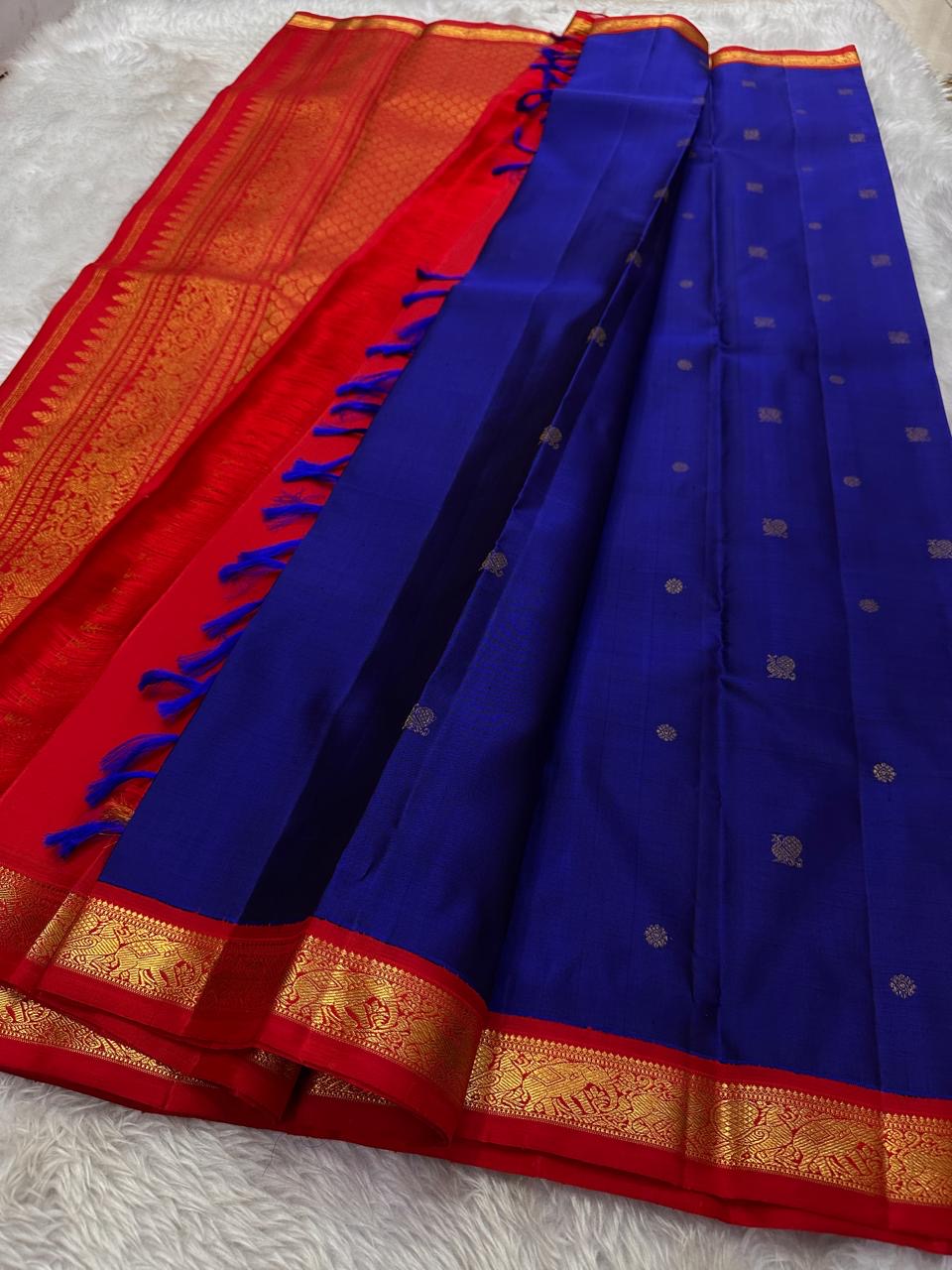 Pure silk Zari kattam butta pink and red saree with peacock, kamalam and kolam motifs