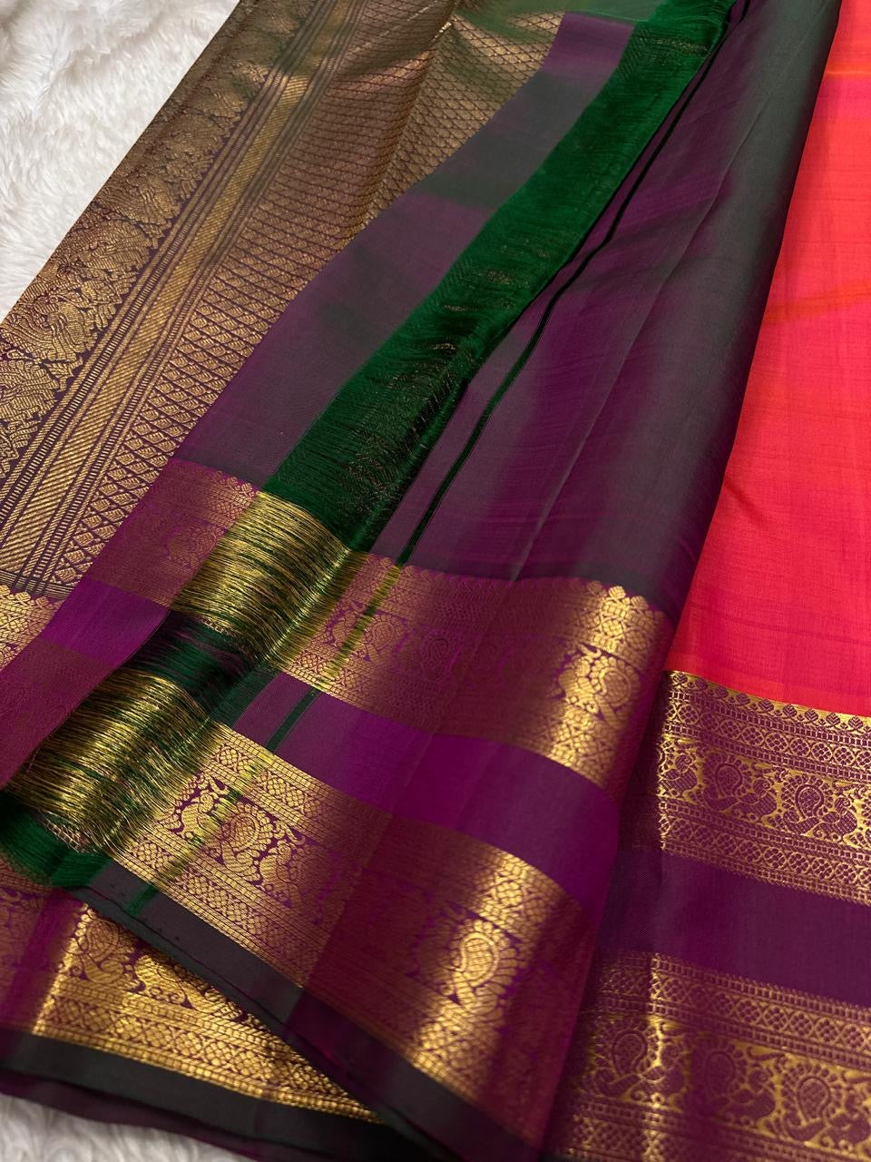 Rani Kalash – Pure Silk Kanchipuram Saree
Vibrant Rani Pink Body with Kalash Zari Buttas ✨
Deep Plum Korvai Borders in Lustrous Gold Weave
Grand Antique-Gold Brocade Pallu with Temple Elegance
Silk Mark Certified | ships in 2 weeks