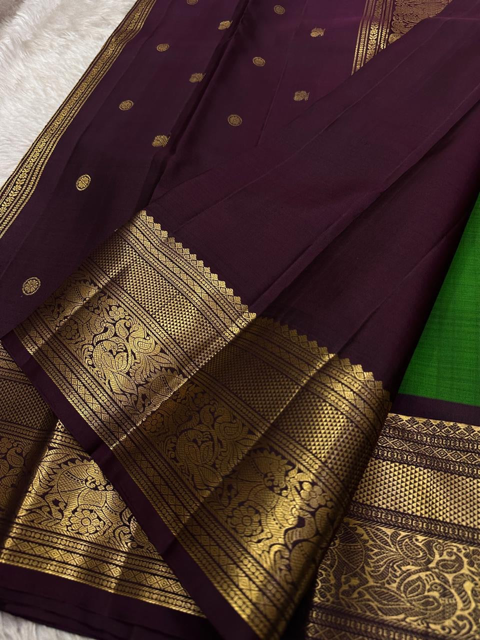 Harita Butta Brown – Pure Silk Kanchipuram
Harita-green body with gold buttas & aubergine-brown zari border
Silk Mark Certified • Free USA Shipping • Ships in Two Weeks