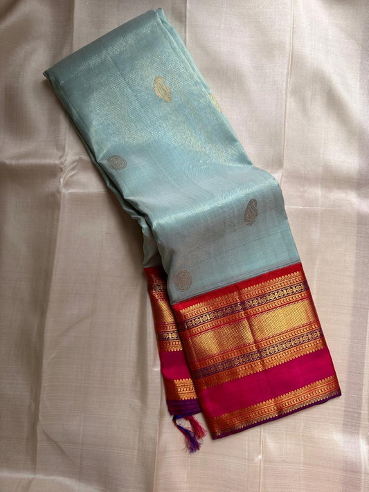 Sky Blue Vairaoosi — Pure Silk Kanchipuram Saree
Rani Pink Korvai Border & Red Brocade Pallu
Silk Mark Certified • Free USA Shipping • Ships in Two Weeks