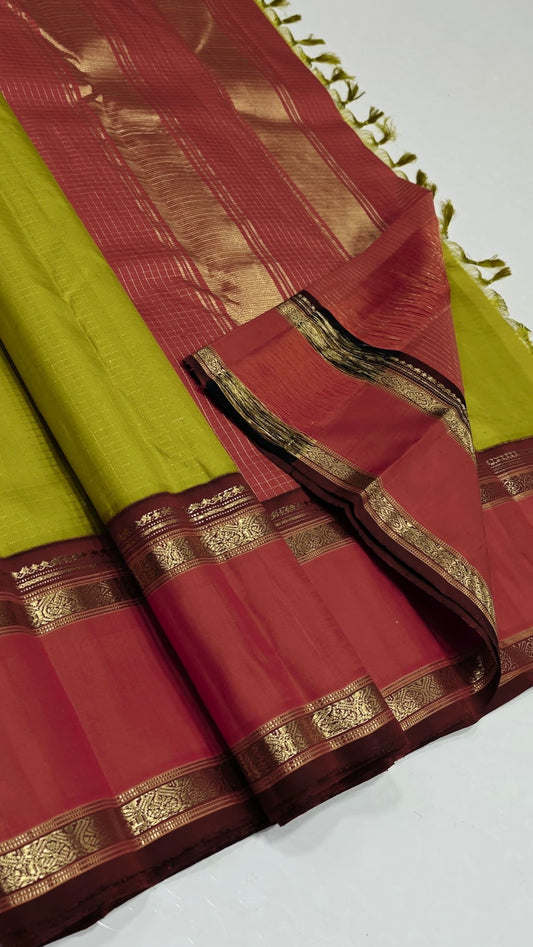 Poornima — Pure Kanchipuram Silk Saree (Lime Green × Sindhoor Red)
Elegant haritha-lime body with subtle self-checks and rich sindhoor-red korvai borders in pure zari weave
Silk Mark Certified • Fall & Pico Done • Blouse Stitching Available ($30) • Free S