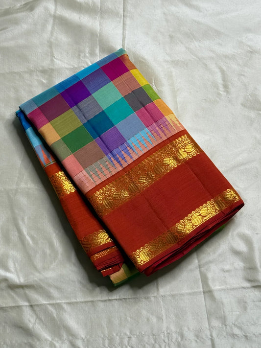 Close view of multicolor checkered Kanchipuram silk saree with red border and traditional gold zari weaving