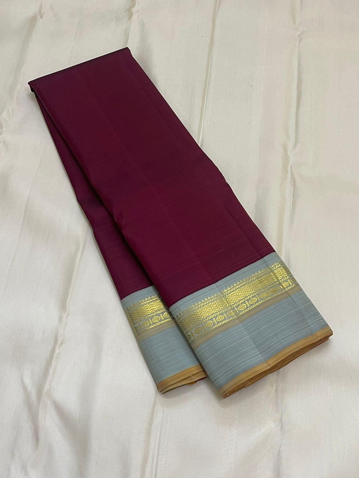 Deep Ruby Dove Grey – Pure Silk Kanchipuram Saree
Korvai Weave with Elegant Contrast Borders
Golden Zari detailed Pallu
Silk Mark Certified | Fall & Pico Done | Blouse Stitching Available ($30)