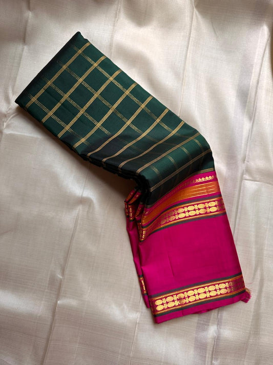 Rani Maragatham Zari Kattam — Pure Silk Kanchipuram (Handloom)
Emerald green body with fine gold kattam checks & zari lines • Vibrant rani-pink border with temple coin motifs
Rich rani-pink pallu with antique-gold zari panels • Silk Mark Certified ✅ Free