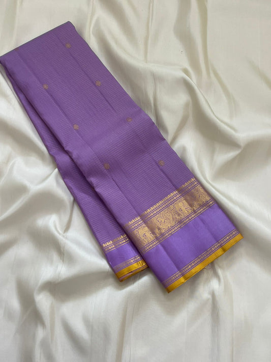 Blooming Lavender — Pure Silk Kanchipuram
Lavender body with oosi-kattam pinstripes, gaja-paisley zari borders & turmeric-gold selvedge ✨
Silk Mark Certified • Antique Zari Weave • Ships in Two Weeks • Free Shipping within USA