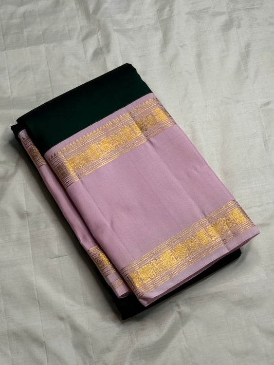 Harita Lavender — Pure Kanchipuram Silk Saree
Forest-green body with antique-gold rosette buttas, paired with lavender korvai borders in temple zari.
Grand lavender brocade pallu • Silk Mark Certified • Free USA Shipping • Ships in Two Weeks.
