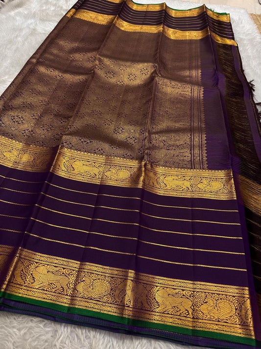 Pure silk kanchipuram aubergine / deep purple / wine  Zari  kattam  with butta rettapet border with Zari stripes intricate pallu with green selvedge
