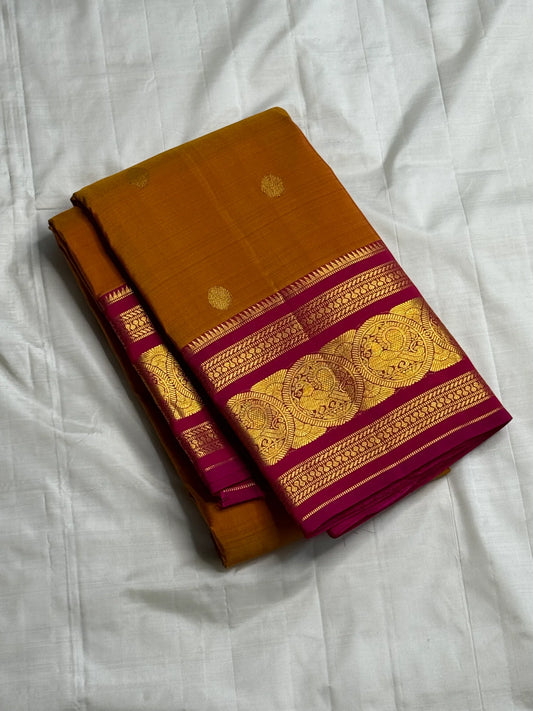 Rust Orange Pink Radiance — Pure Silk Kanchipuram
Earthy rust-orange body with gold coin buttas & rani pink korvai border in grand zari medallions
Silk Mark Certified • Free USA Shipping • Ships in Two Weeks ✅