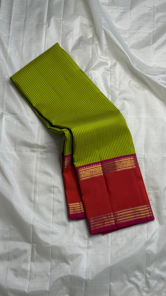 Ilai Pachai & Vermilion Korvai Pure Silk Kanchipuram Saree
Parrot-green kasa kasa kattam checks with vermilion borders & rani-pink pallu
Silk Mark Certified • Ships in two weeks • Free Shipping within USA