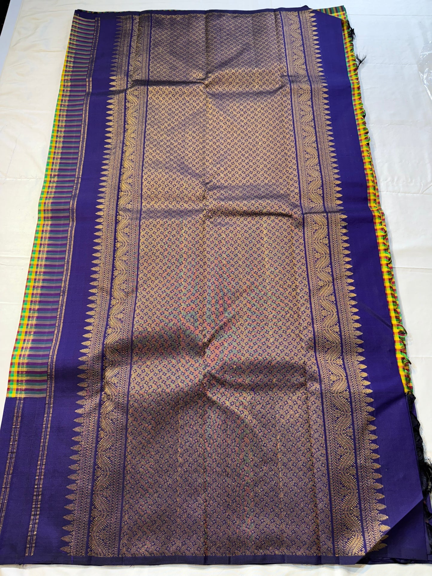 Vriksham ✨
Pure Kanchipuram Silk Saree in Multicolor Checks & Purple
kattam body in yellow, green, red & Rama blue
Royal purple border with zari Tree-of-Life & birds
Silk Mark Certified, delivery in 2 weeks