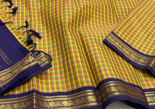 Forest Blossom Kattam — Pure Silk Kanchipuram Saree
Parrot-green, rani-pink & haldi-yellow kattam checks
Deep navy korvai borders with antique gold zari vines
Rich navy zari-striped pallu with tasseled edges
Silk Mark Cert • Free USA Shipping 1 week