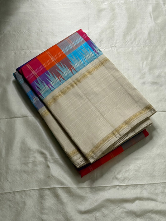 Venpattu Kattam Thazampoo Reku – ivory/venpattu borders with multicolor kattam (checks) body
Pure Kanchipuram silk • rani pink, tangerine, purple, sky blue & steel grey checks with thazampoo reku edging
Ivory pallu with gold tissue stripes & multicolor