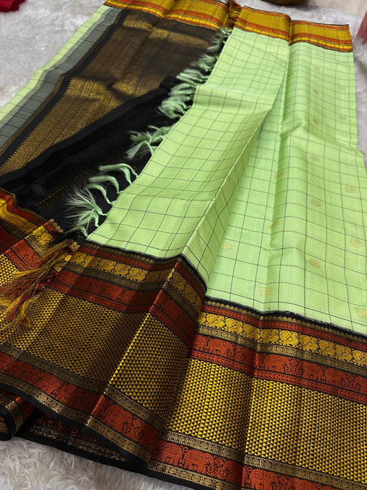 ✨ Elakkai Kattam — Pure Silk Kanchipuram Saree ✨
Cardamom-green body with black kattam checks and gold buttas, contrasted by kumkum-rust & kanak-gold borders with elephant zari and a rich black brocade pallu.
Silk Mark Certified ✅ • Fall & Pico Done ✅ •