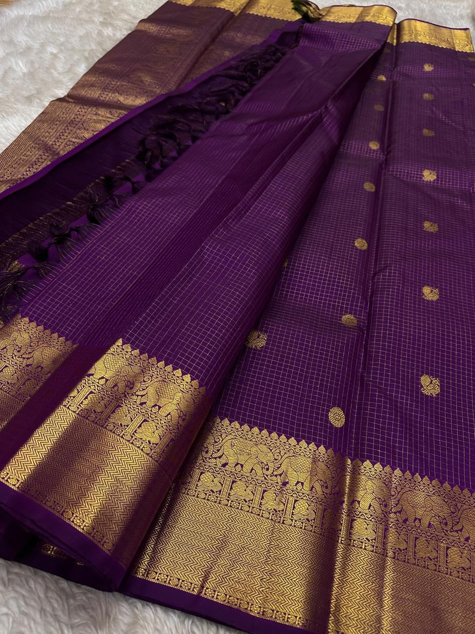 Subha Kattam — Pure Silk Kanchipuram Saree
Vadamalli purple saree with gold buttas & fine kattam checks ✨
Elephant zari borders, grand pallu, Silk Mark Certified ✅ • Free USA Shipping 🇺🇸 • Ships in 2 Weeks 🚚