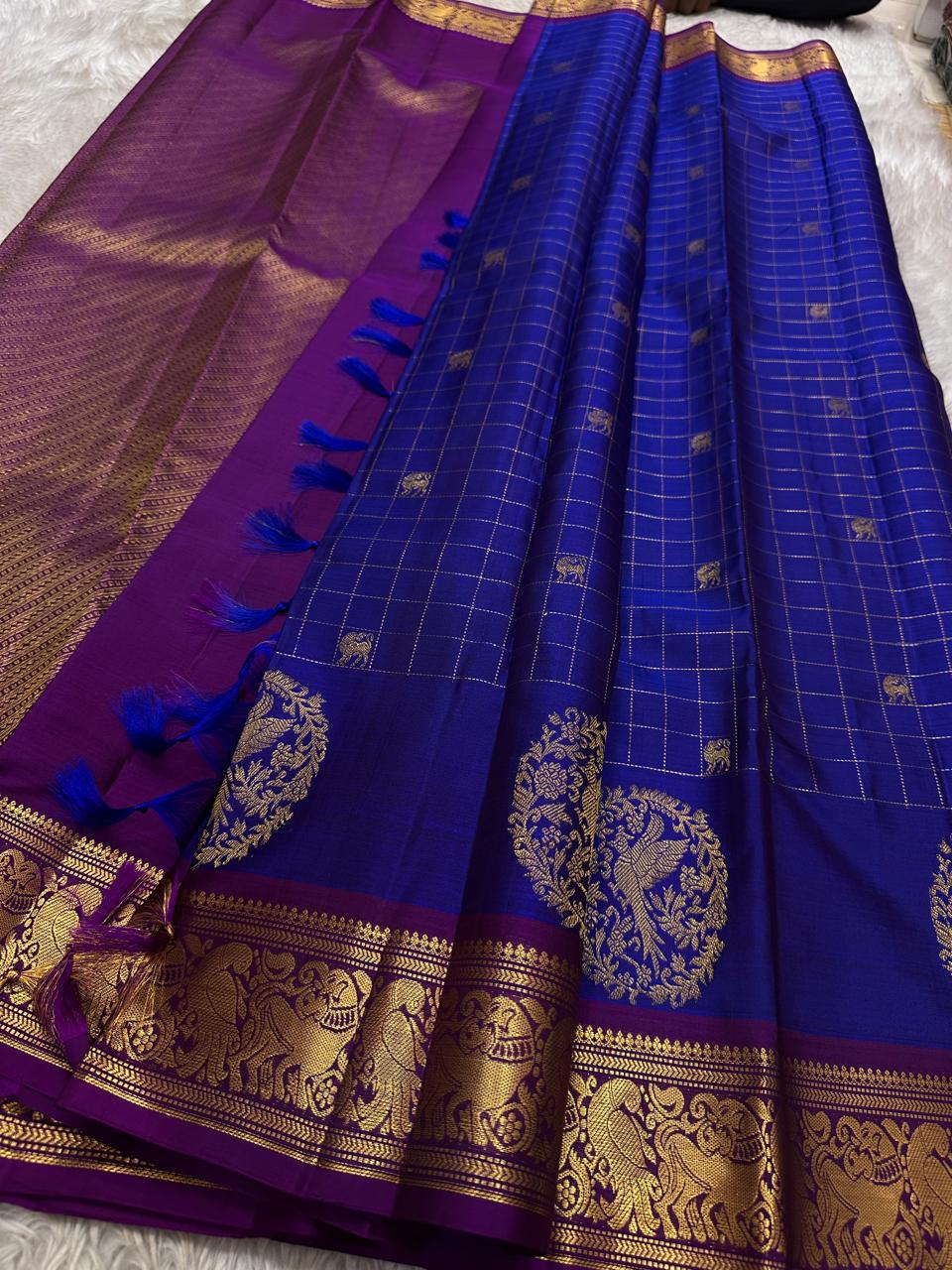 Sorgavaasal Kili , stunning motif in MS blue and purple zari kattam zari woven yazhi buttas in pure silk kanchipuram
