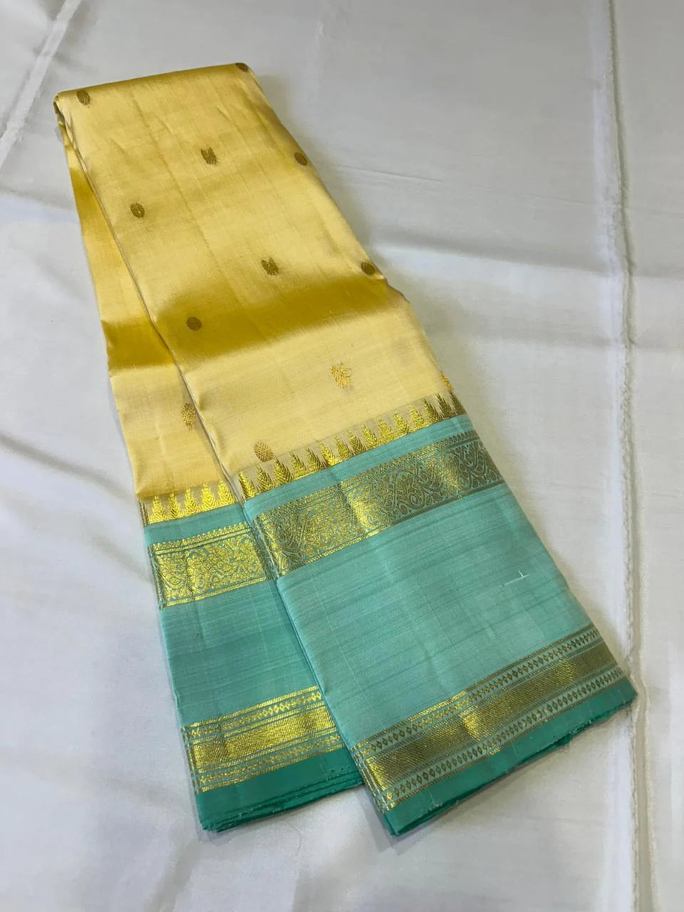 Sunlit Butter Yellow ✨ – Pure Kanchipuram Silk Saree in Butter Yellow & Sea Green with Gold Zari Temple Border & Grand Brocade Pallu – Silk Mark Certified, Fall & Pico Done, Blouse Stitching Available, ships in 2 weeks