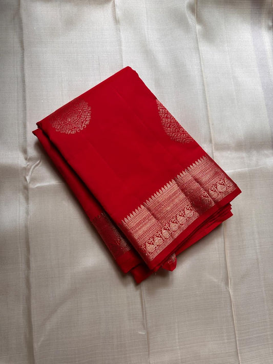 Thamarai Red — Pure Kanchipuram Silk Saree
Temple Red with Gold Zari Leaf Buttas & Diamond Jaal Pallu
Silk Mark Certified • Free Shipping within USA • Ships in Two Weeks
