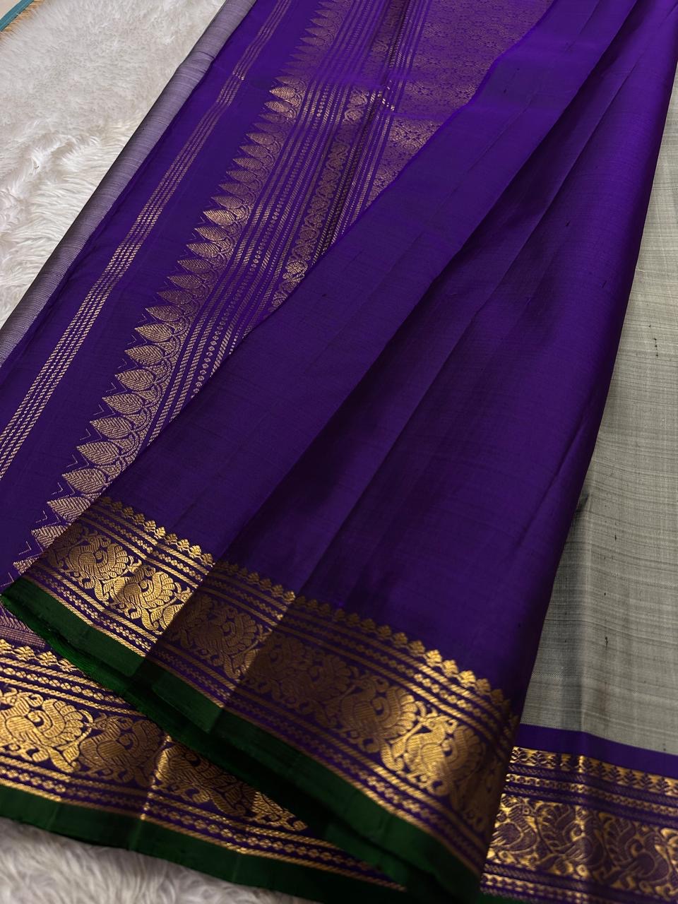 Dove Gray Mayuri — Pure Kanchipuram Silk Saree ✨
Soft dove-gray body with gold coin buttas, violet borders & emerald selvedge 💜
Silk Mark Certified ✅ | ships in two weeks