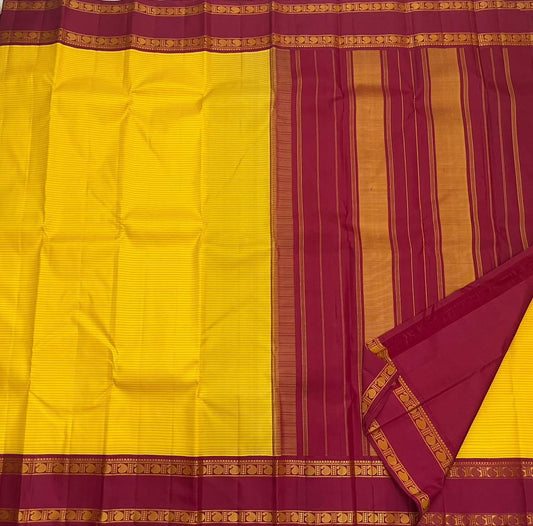 Arakku Kanakam — Pure Silk Kanchipuram Saree
Basanti yellow body with fine varisai pinstripes and rich arakku korvai borders adorned with gold shankh motifs ✨
Silk Mark Certified • Free USA Shipping • Ships in Two Weeks ✅