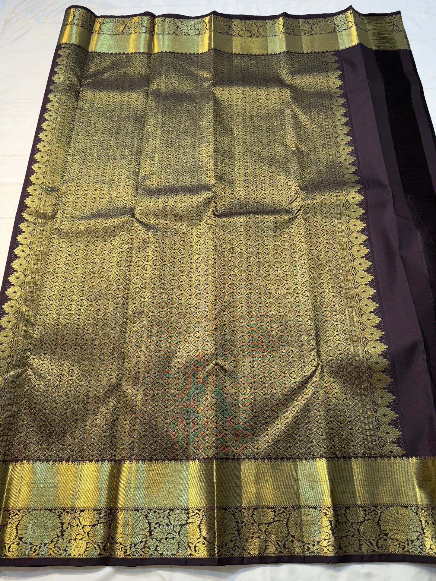 Rust orange Terracotta, Yanai Butta
 — Coffee Brown Korvai Kanchipuram
Deep coffee-brown korvai borders with wide antique-gold kaddi & floral vines
Silk Mark Certified | Free Shipping within USA | Ships in Two Weeks
Blouse Stitching available $30
