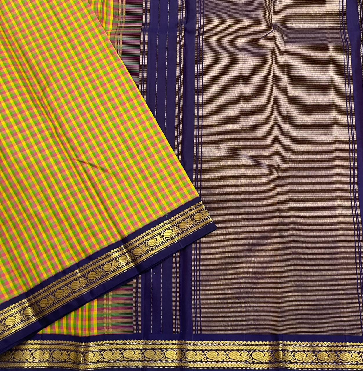 Forest Blossom Kattam — Pure Silk Kanchipuram Saree
Parrot-green, rani-pink & haldi-yellow kattam checks
Deep navy korvai borders with antique gold zari vines
Rich navy zari-striped pallu with tasseled edges
Silk Mark Cert • Free USA Shipping 1 week