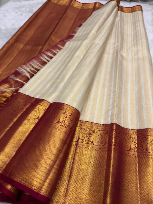 Close-up of ivory silk body with ornate all-over gold zari weave — Kanchi Pattu Butta saree body detail