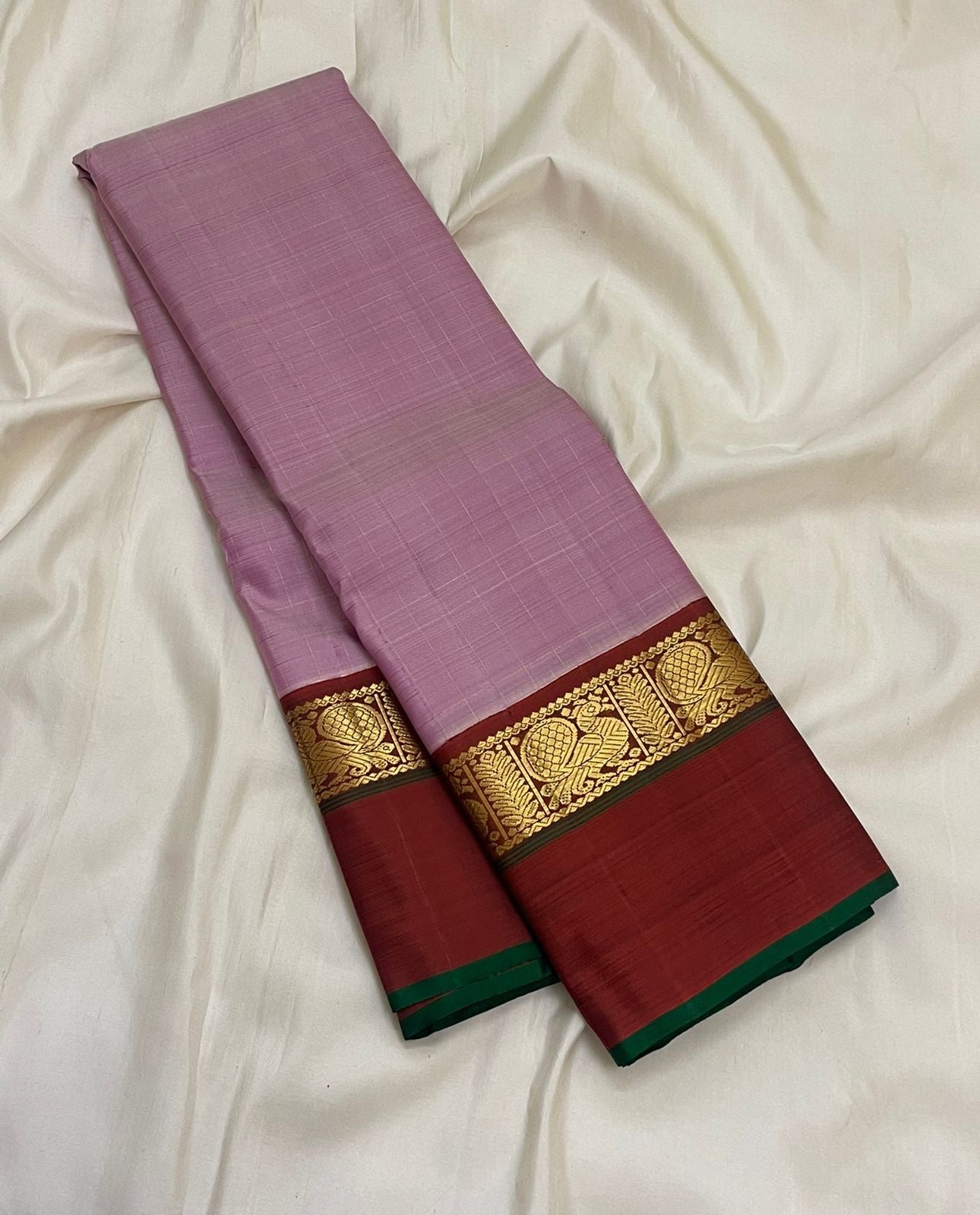 Kaal Irangiya pineapple motif zari detail on deep maroon Korvai border of mauve pink Kanjivaram saree