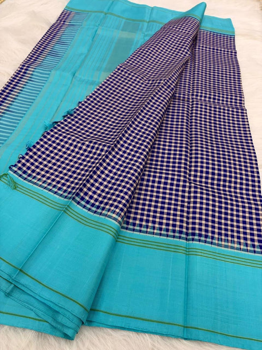 Sky blue border detail with green silk stripe lines on handwoven navy blue and white Kanchi Kattam Kanchi Pattu saree
