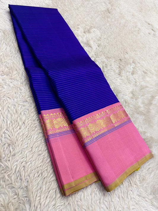Royal blue and radiant pink handwoven pure silk Kanjeevaram saree with Korvai Kaal Irangiya geometric border — full folded overview