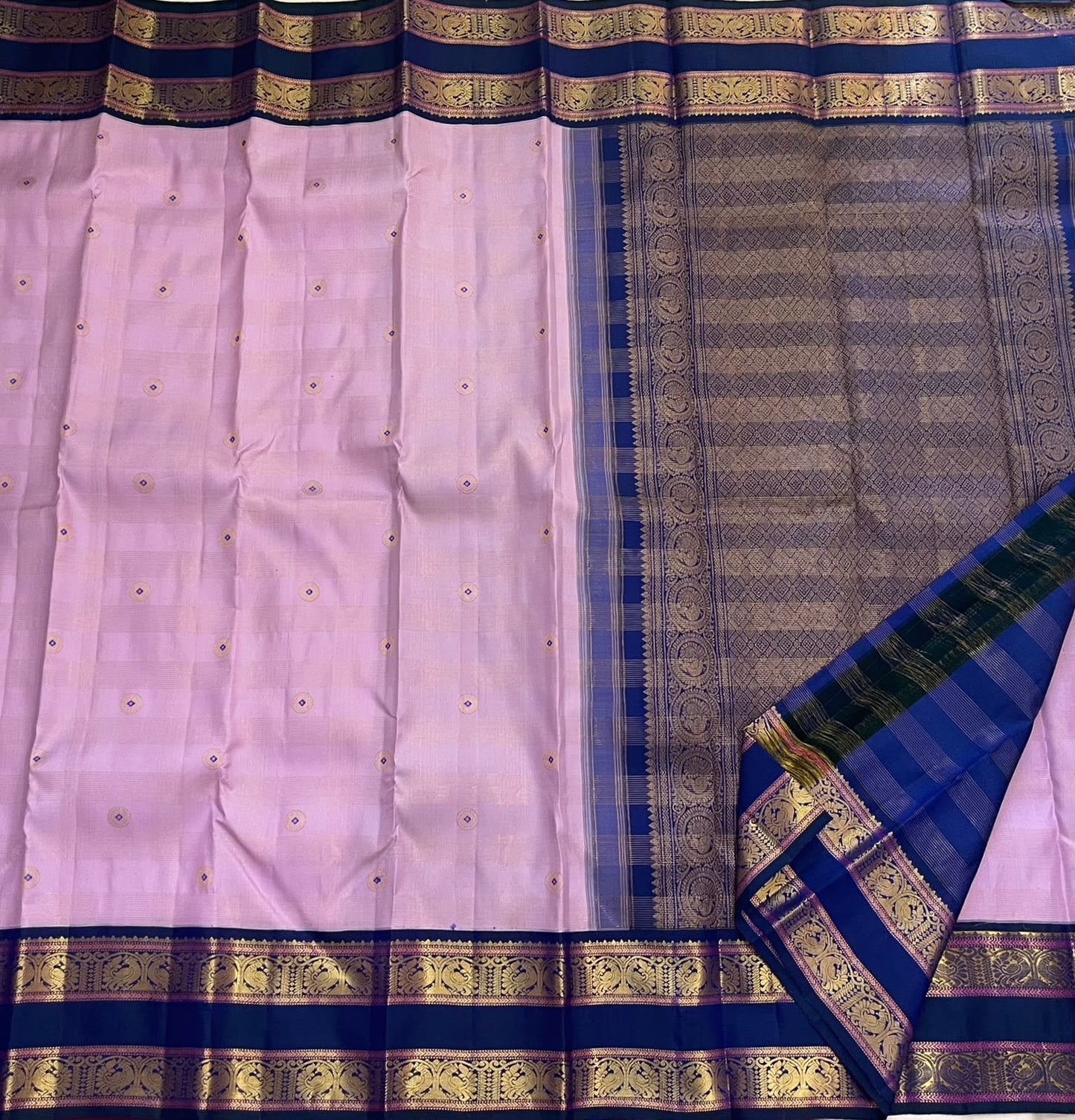 Deep navy Rettapet border with grand Mayil Butta peacock figurals in antique gold zari — Kanjipuram saree detail