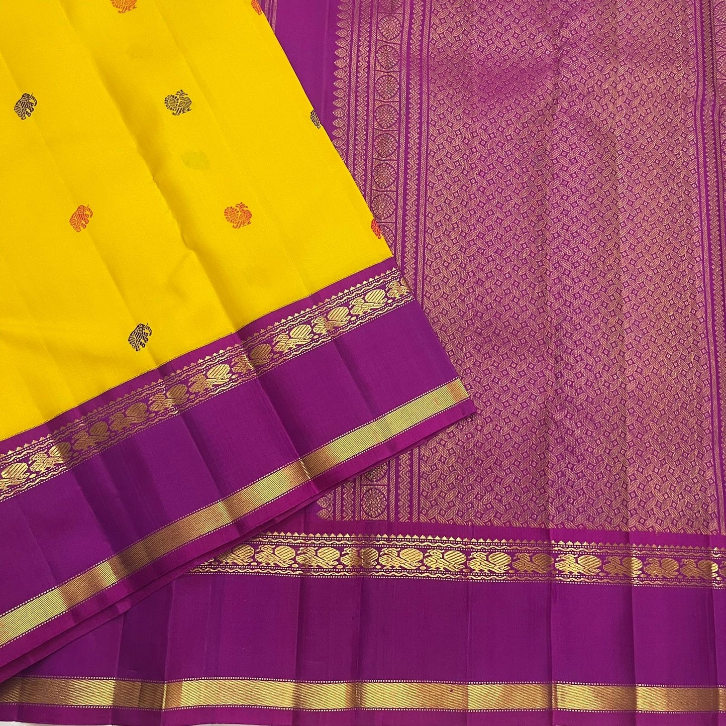 Silk thread butta detail on canary yellow handwoven pure silk Kancheepuram Rettapet saree — zari close-up
