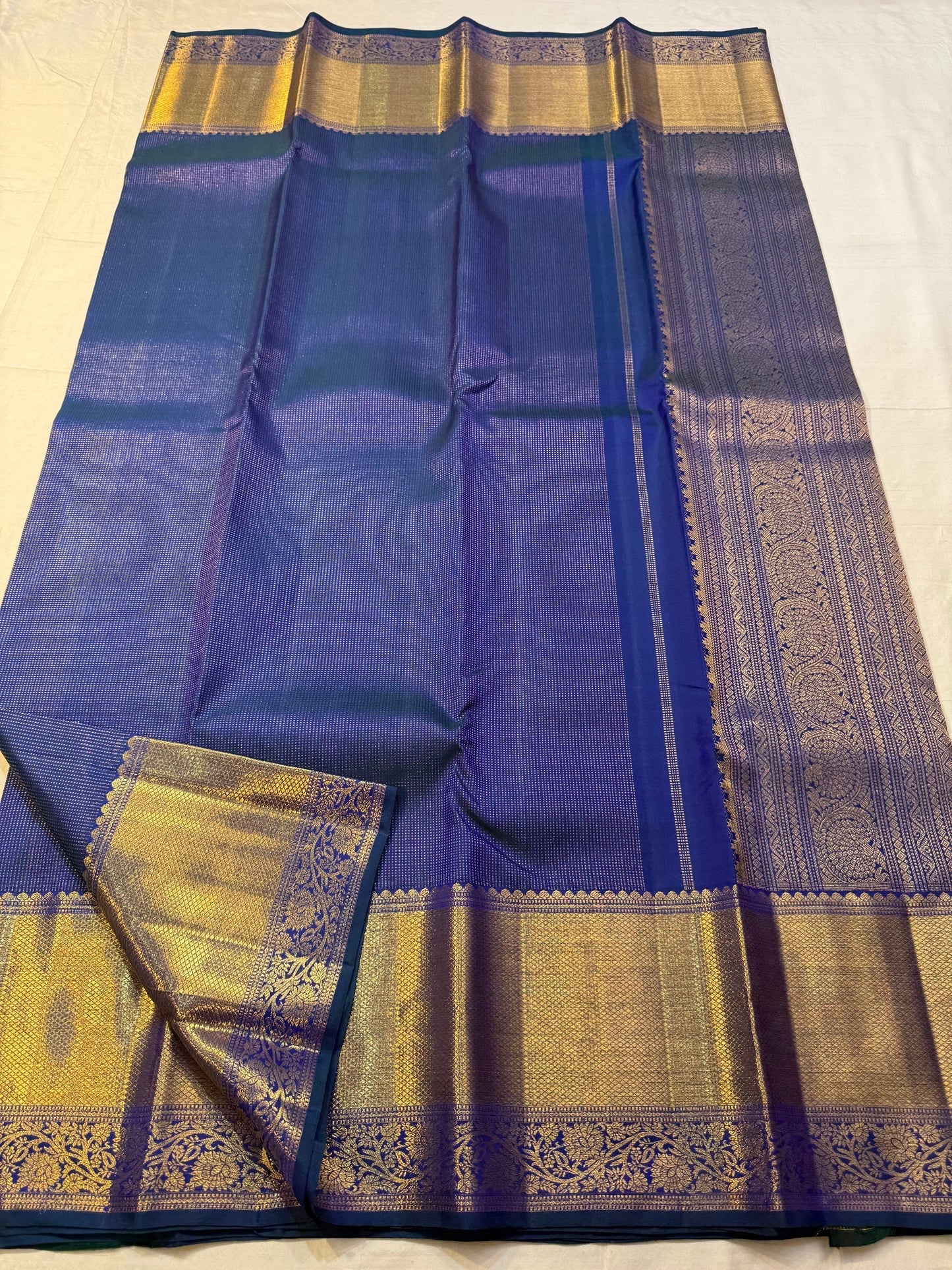 Navy blue Kanchipuram pallu with elaborate Kodi climber gold zari work — full spread