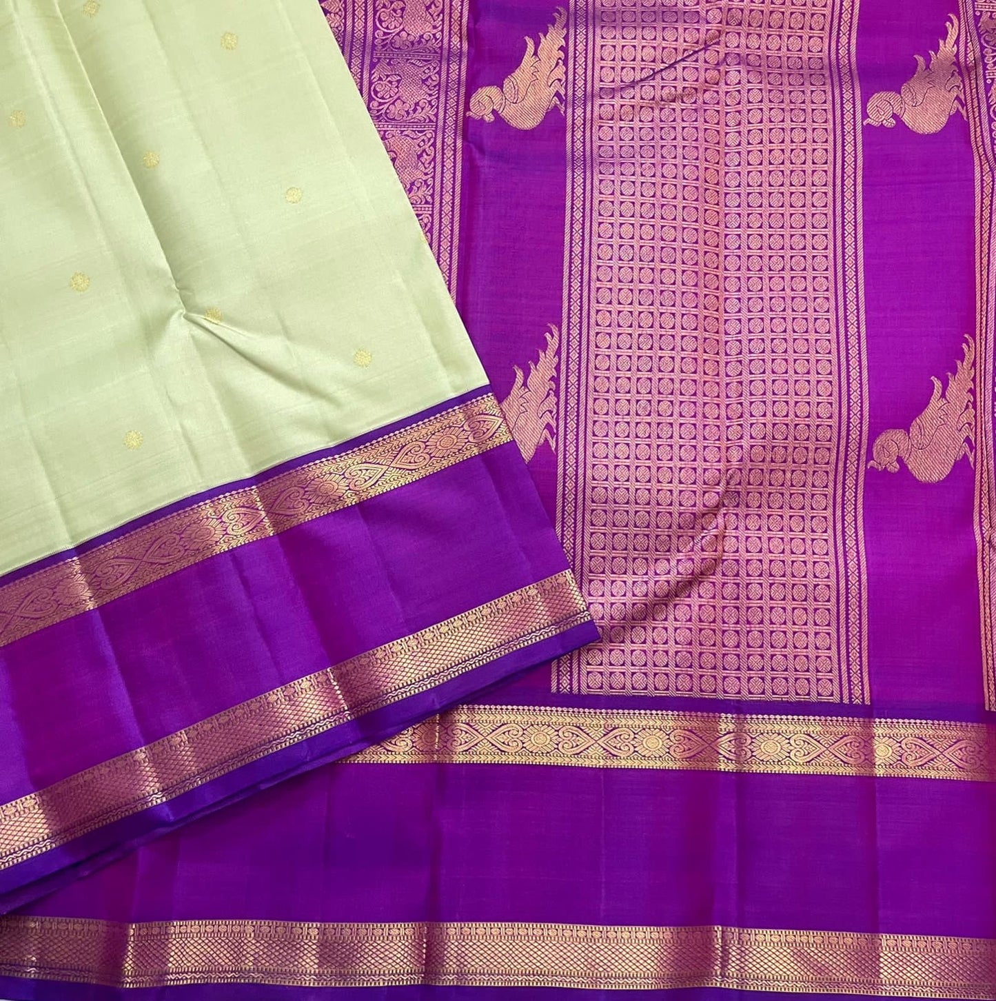 Gold zari Kamalam butta lotus medallion detail woven into pistachio green silk body of Kancheepuram saree