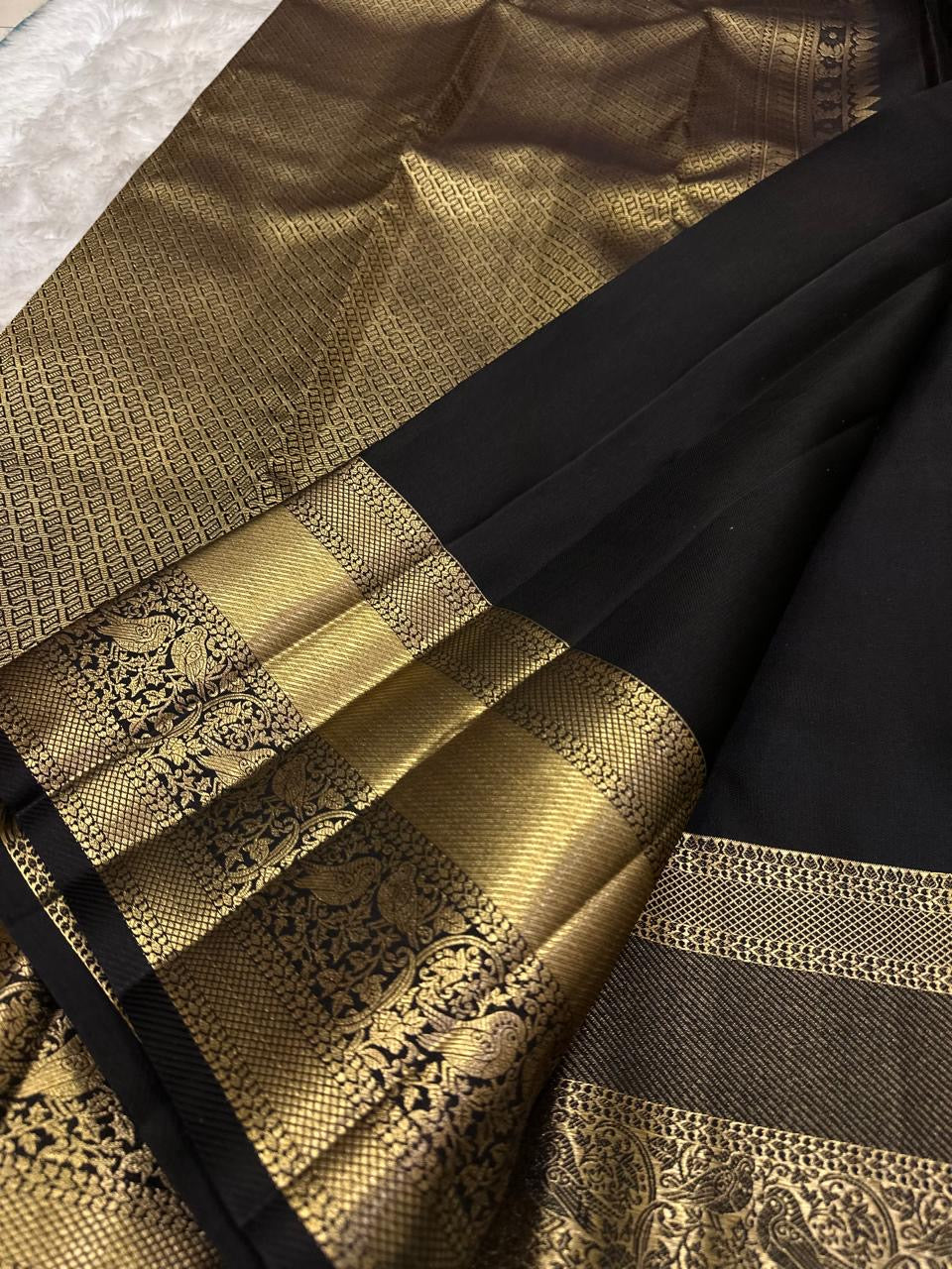 Raven Black Handwoven Pure Silk Kanjeevaram Saree with Zari Kattam and Antique Gold Peacock Border