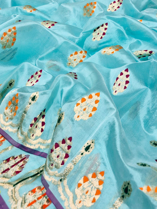 Aqua blue Chanderi silk saree showing multicolour ornamental woven border and luminous metallic pallu