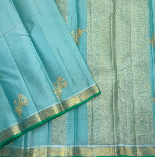 Aqua Ice Blue pure silk Kanjivaram Vairaoosi saree with soft gold zari and green selvedge.