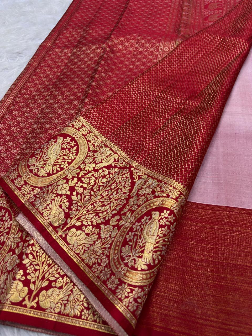 Close view of tone-intensive floral jaal weaving across Pearl Ivory pure mulberry silk Kanjivaram saree.