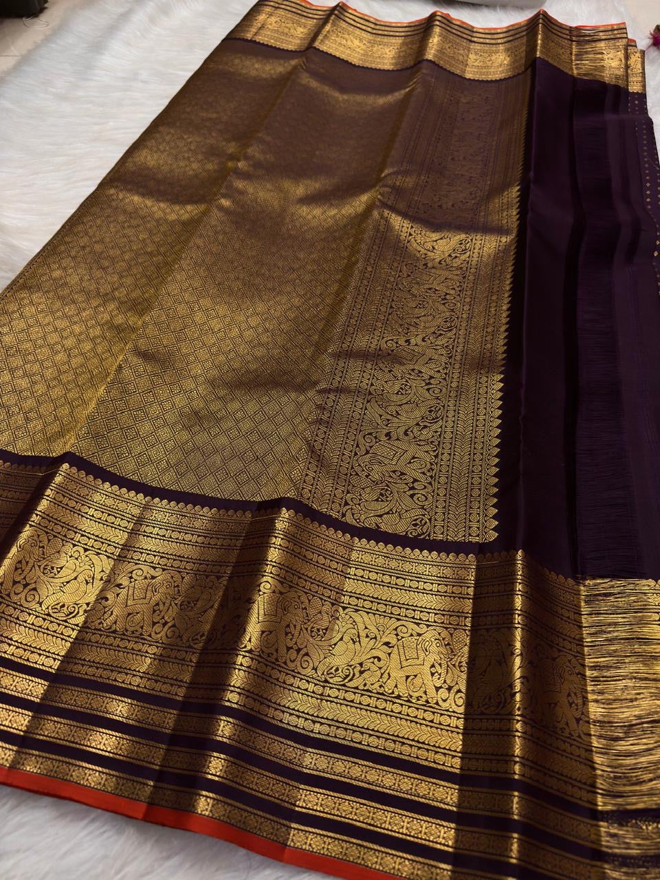 Traditional Mayil peacock border in antique gold on Deep Aubergine Purple Kanjivaram saree.