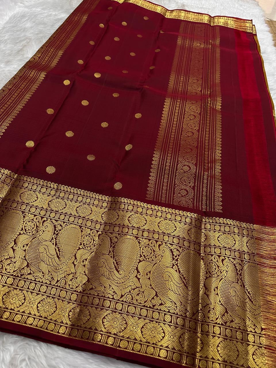 Majestic Kanchipuram silk saree with burnished gold body and maroon selvedge accents