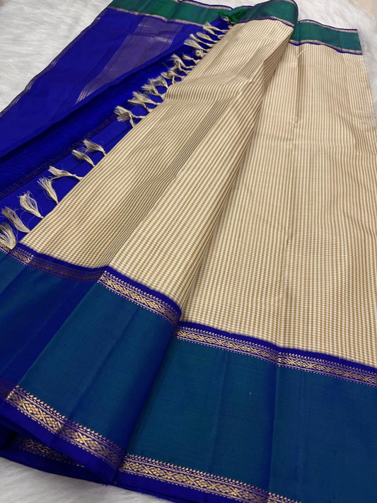 Royal blue Rettapet border detail on beige Kanjivaram silk saree