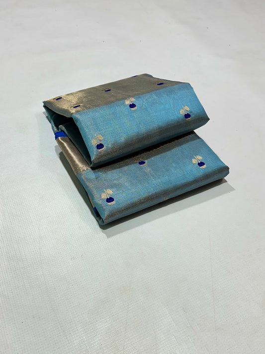 folded blue silk saree with gold border