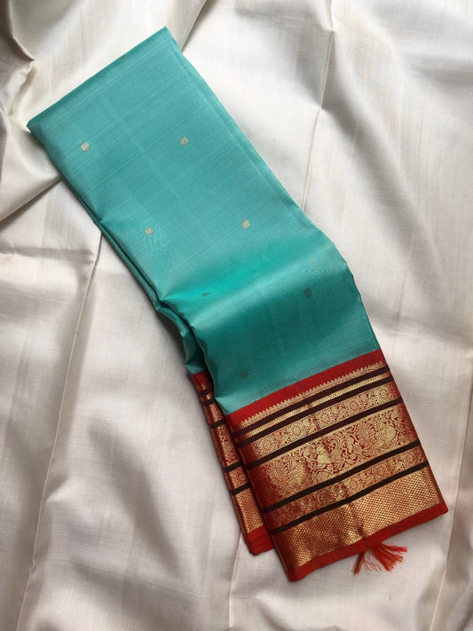 Broad Burnt Orange Kanchipuram border with layered antique gold zari registers