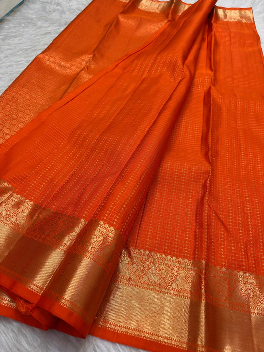 Burnt Orange pure silk Kanjivaram saree with fine antique-gold woven pattern.