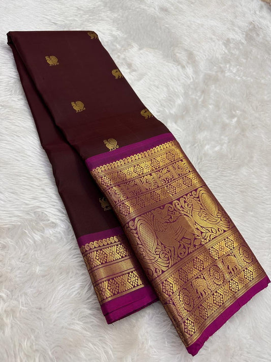 Handwoven Kanjeevaram saree featuring deep espresso brown body and vibrant rani pink border