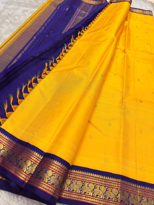 Canary yellow silk saree with Yaanai elephant border and gold zari — border detail