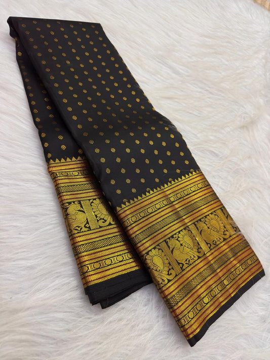 Classic Black handwoven pure silk Kancheepuram Butta saree — peacock motif border close-up — Idam Living