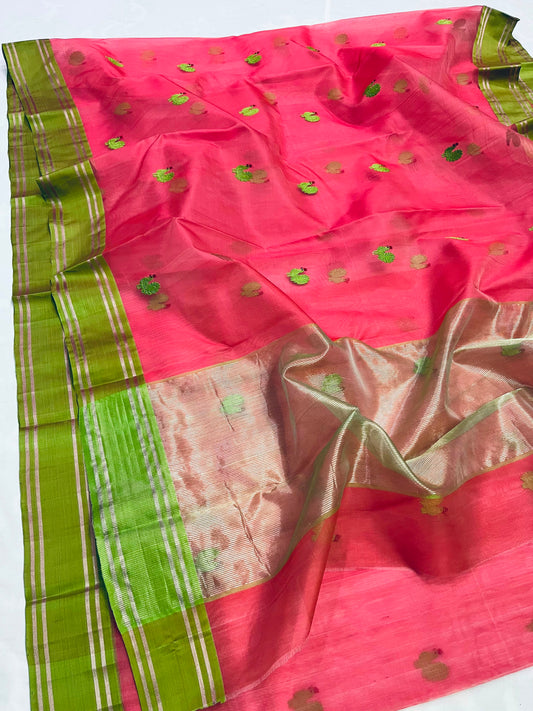 Close-up of green rooster-inspired buttas woven on coral pink Chanderi silk