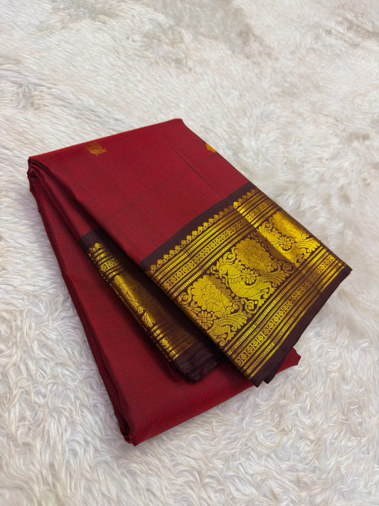 Kamalam butta in gold zari close-up on arakku red Kanjivaram pure silk saree — Idam Living