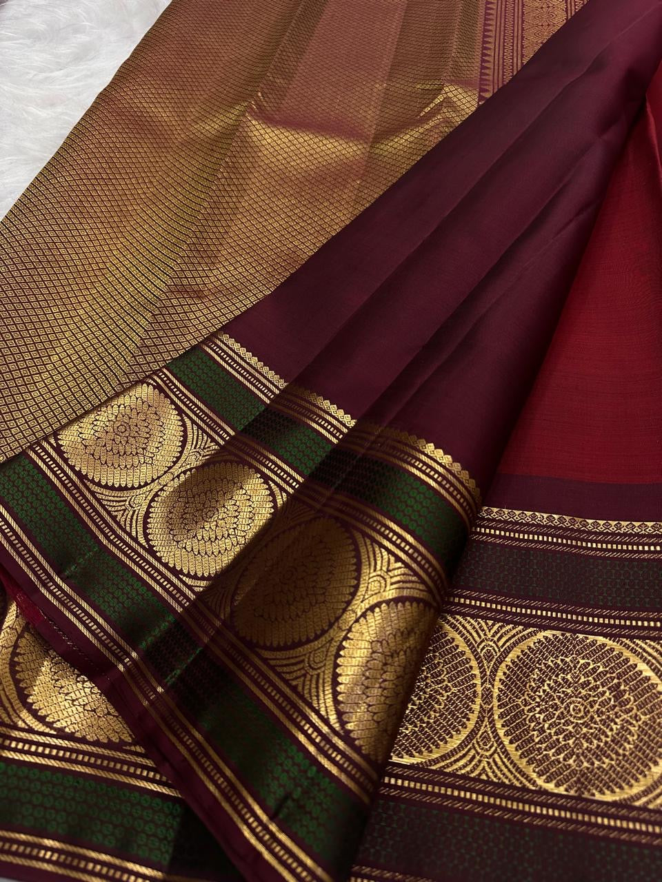 Deep Arakku Red Kanchipuram silk saree with petite scattered gold zari buttas